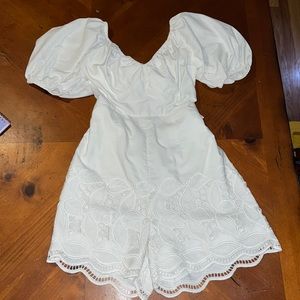 Beautiful embroidered and cutout lace romper by Ranna Gill for Anthropologie.